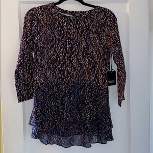 Vera Wang speckled navy blue top.